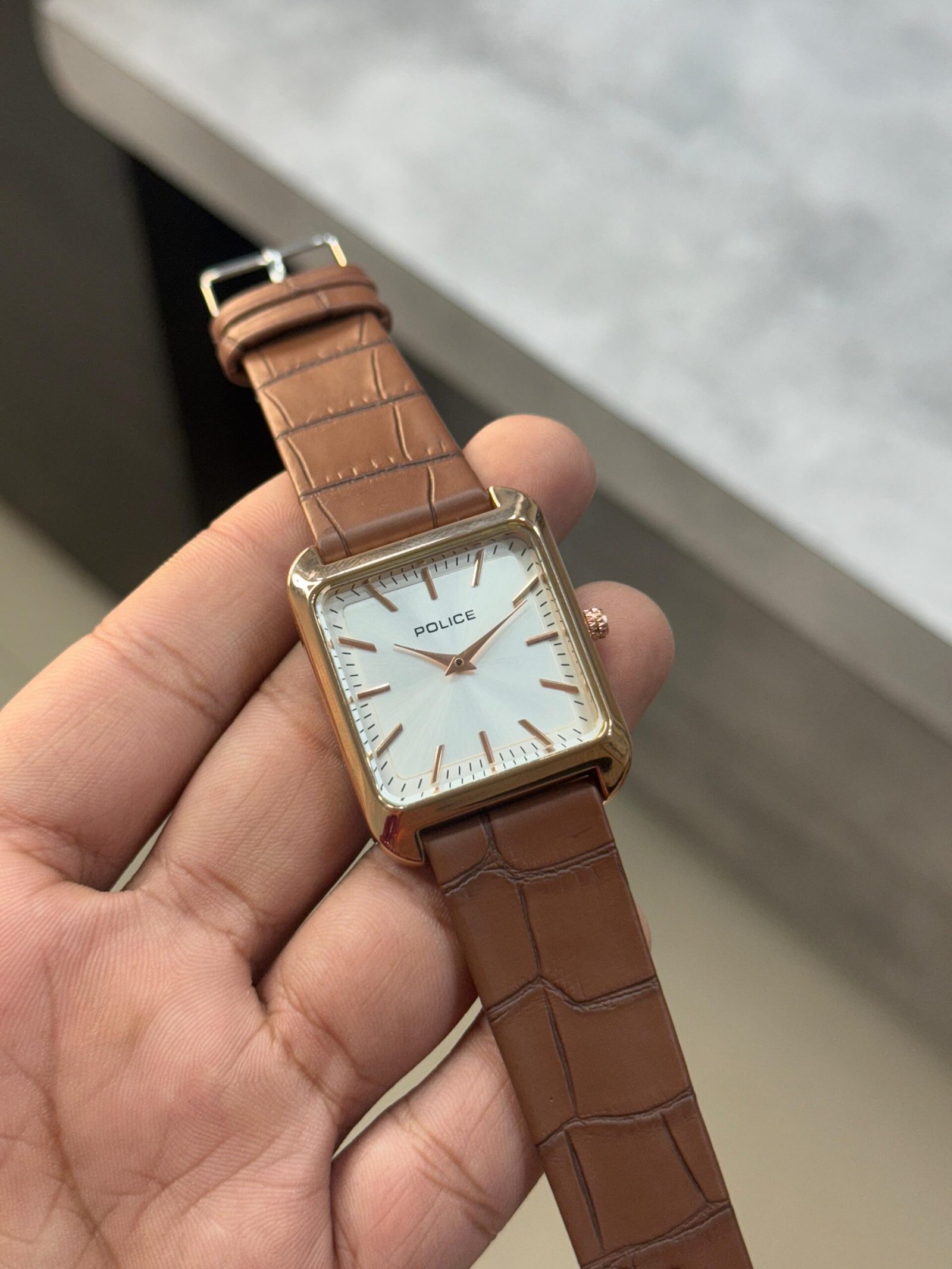 Police men's analog quartz watch with a square rose gold-tone case, white dial, and a brown crocodile-pattern leather strap
